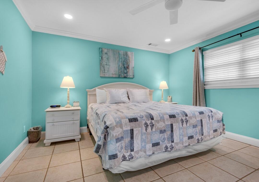 85 Breakwater Bay, Unit 10D Miramar Beach, FL 32550 - Photo 16 of 39 a bedroom with a bed and a window