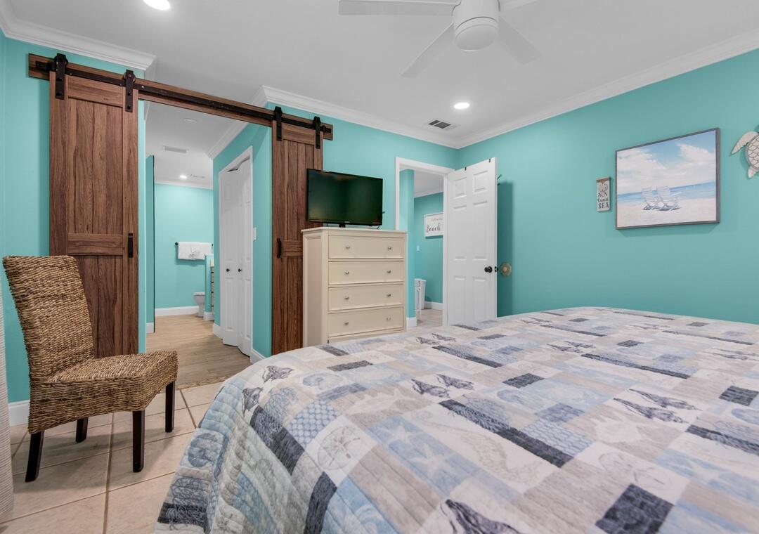 85 Breakwater Bay, Unit 10D Miramar Beach, FL 32550 - Photo 17 of 39 a bedroom with a bed and furniture