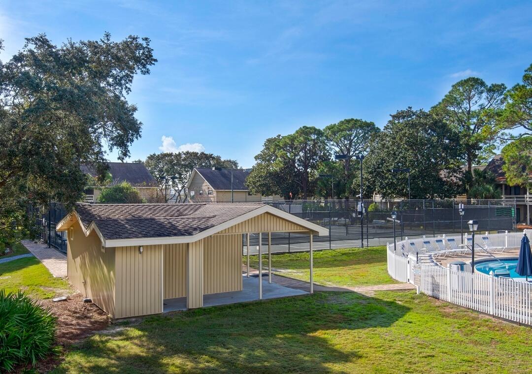 85 Breakwater Bay, Unit 10D Miramar Beach, FL 32550 - Photo 27 of 39 a view of a house with swimming pool and sitting area