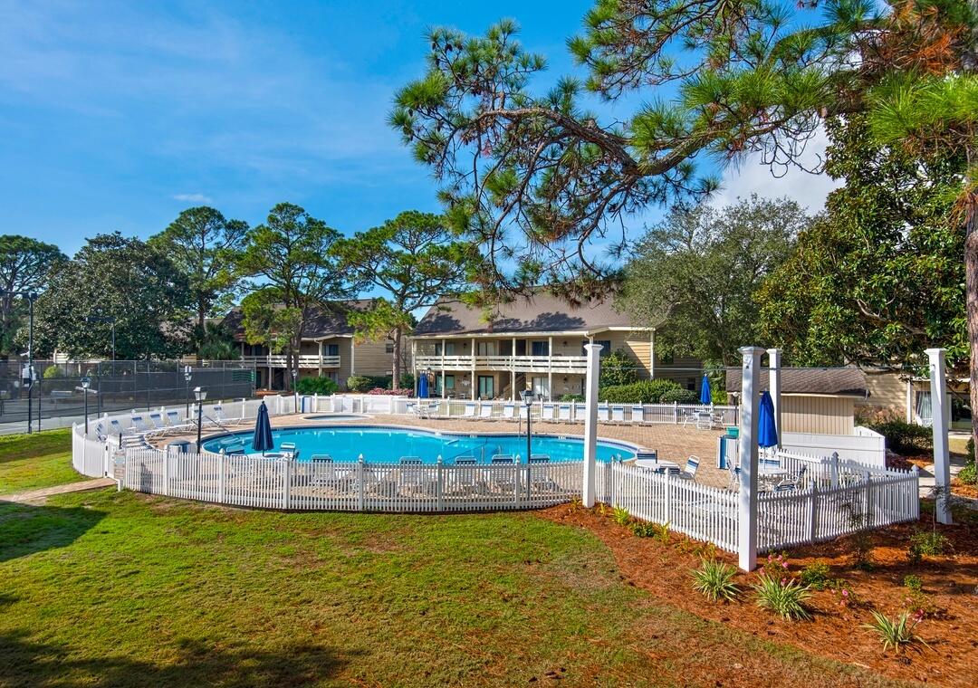 85 Breakwater Bay, Unit 10D Miramar Beach, FL 32550 - Photo 30 of 39 a view of a swimming pool with lounge chairs