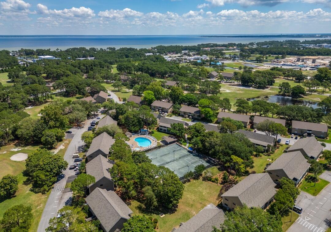 85 Breakwater Bay, Unit 10D Miramar Beach, FL 32550 - Photo 31 of 39 an aerial view of residential houses with outdoor space and trees