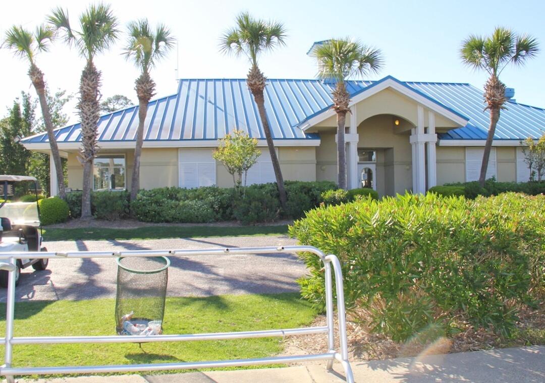 85 Breakwater Bay, Unit 10D Miramar Beach, FL 32550 - Photo 35 of 39 a front view of a house with garden