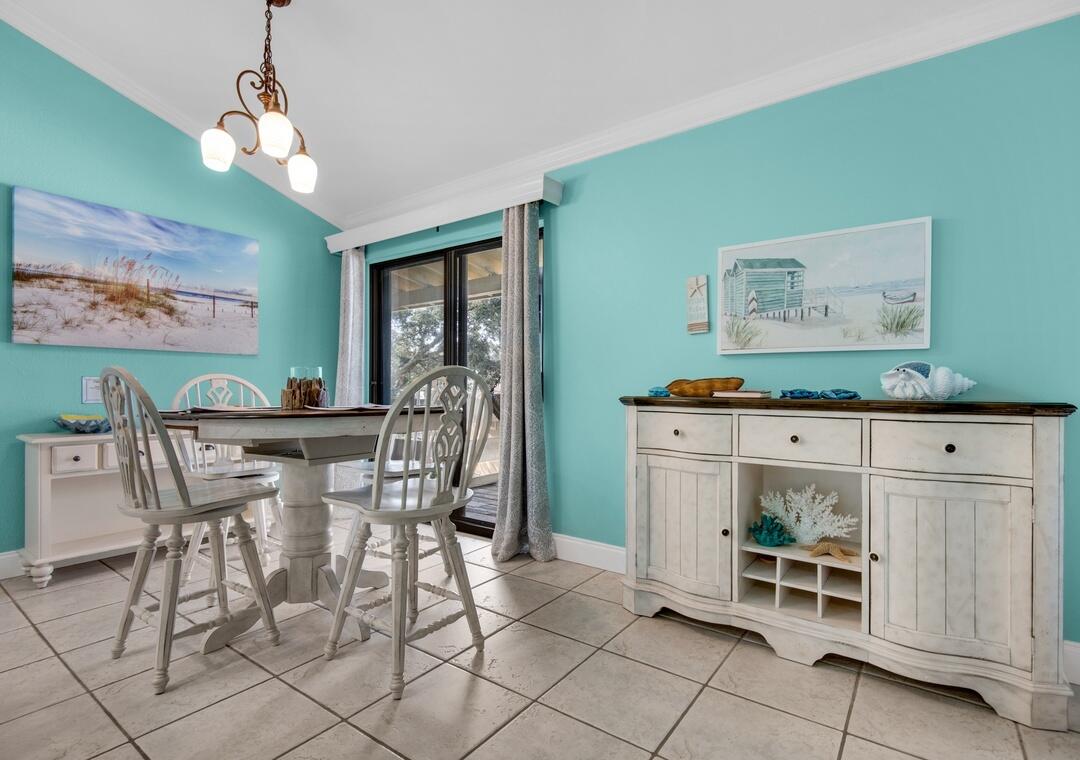 85 Breakwater Bay, Unit 10D Miramar Beach, FL 32550 - Photo 10 of 39 a view of a dining room that has a table and chairs in it