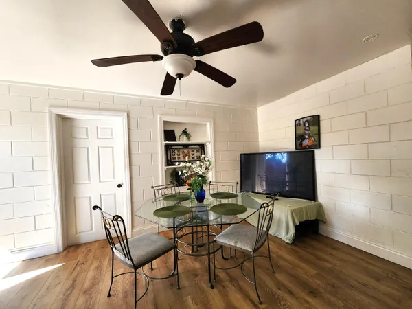 a view of a livingroom with furniture and a flat screen tv