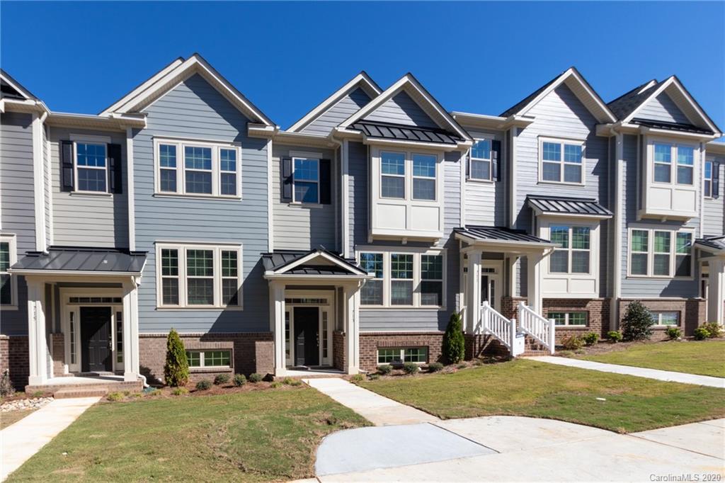 713 Swift Run Tega Cay, SC 29708 - Photo 1 of 8 a front view of a house with a yard