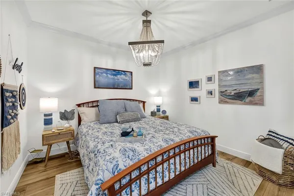 a bedroom with a bed and dresser