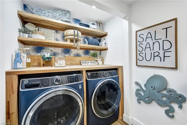 a view of washer and dryer with a kitchen area