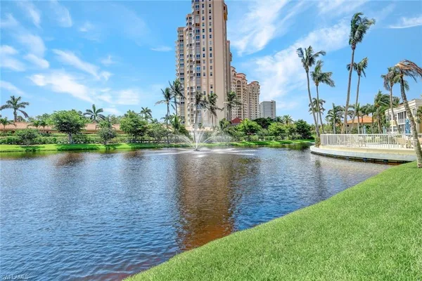 a view of a lake with a large building
