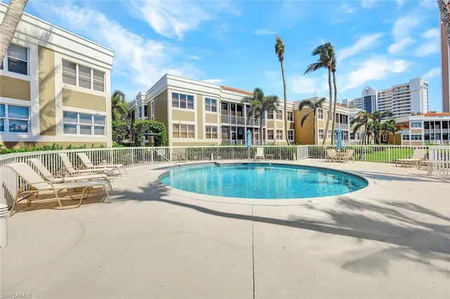 a view of multiple house with a swimming pool