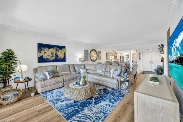 a living room with furniture and a rug