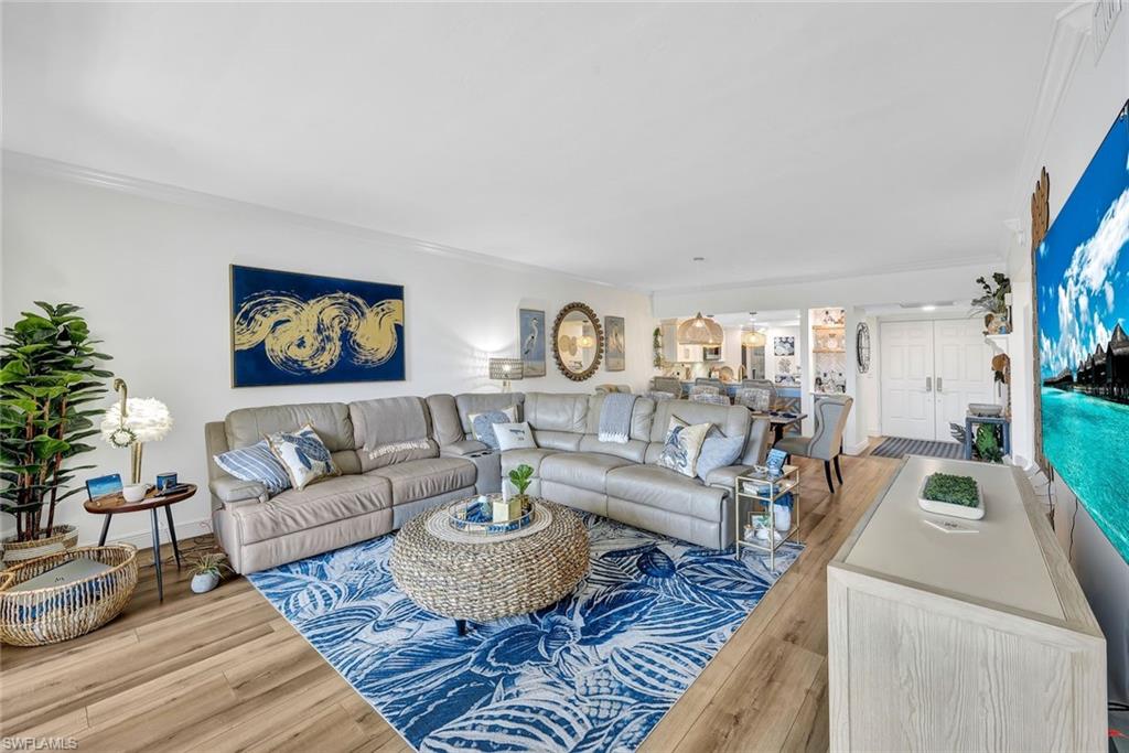 6549 Marissa Loop, Unit 21 Naples, FL 34108 - Photo 2 of 20 a living room with furniture and a rug