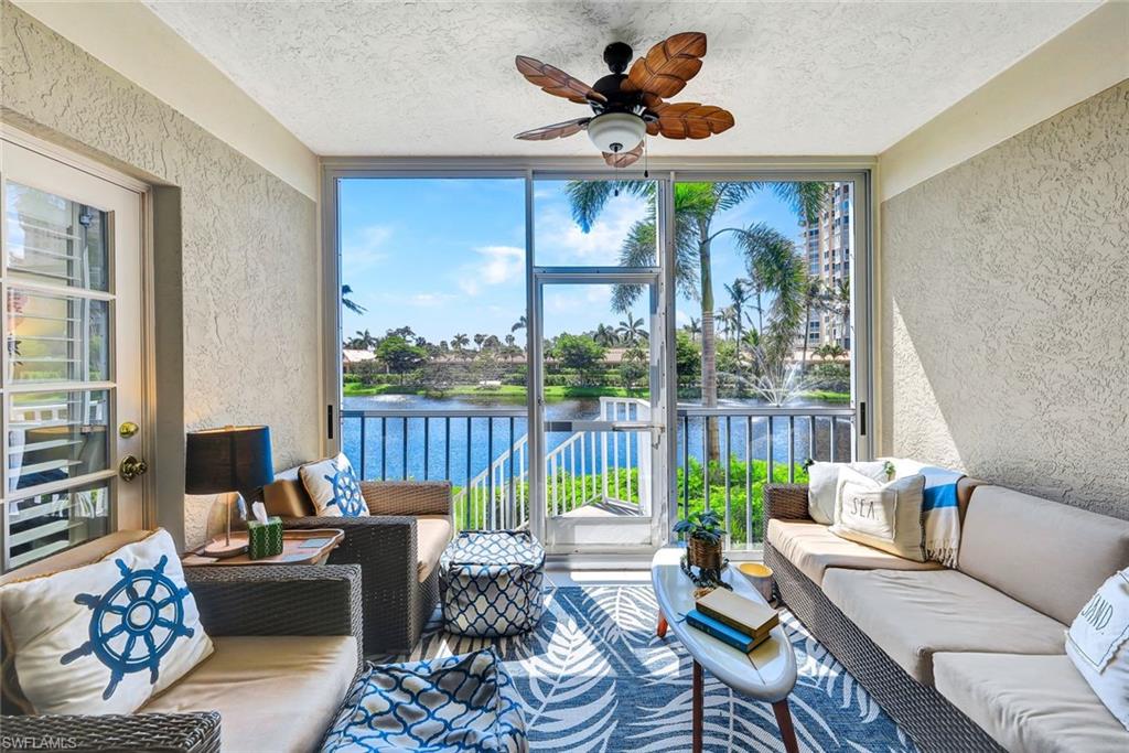 6549 Marissa Loop, Unit 21 Naples, FL 34108 - Photo 4 of 20 a living room with furniture and a large window