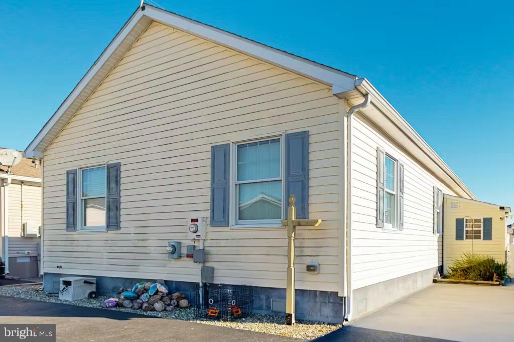 37022 Blue Teal Road Selbyville, DE 19975 - Photo 3 of 20 a front view of a house with street