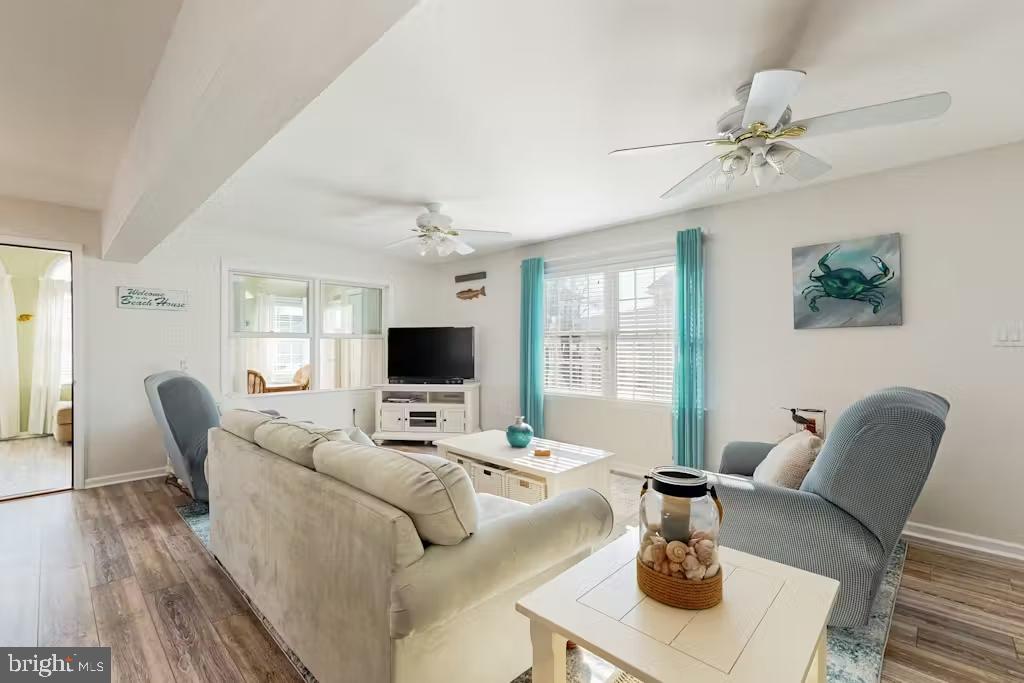 37022 Blue Teal Road Selbyville, DE 19975 - Photo 7 of 20 a living room with furniture and a flat screen tv