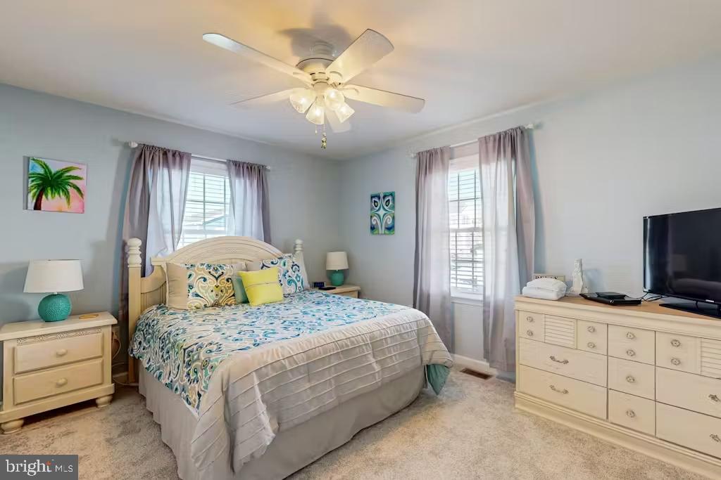 37022 Blue Teal Road Selbyville, DE 19975 - Photo 9 of 20 a bedroom with a bed and furniture