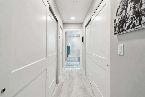 a view of hallway with wooden floor