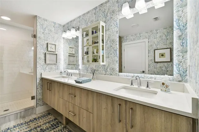 a bathroom with a double vanity sink mirror and double