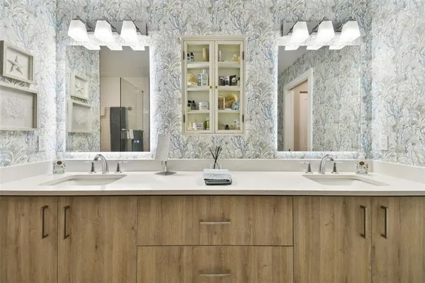 a bathroom with a sink and a mirror
