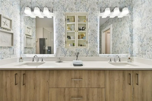 a bathroom with a sink and a mirror