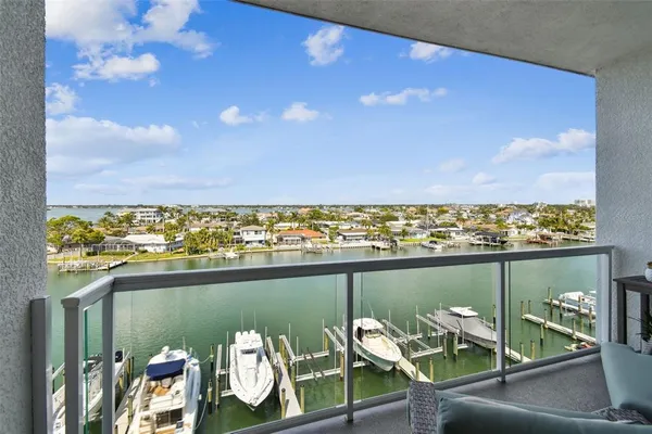 a view of a balcony with chair and table