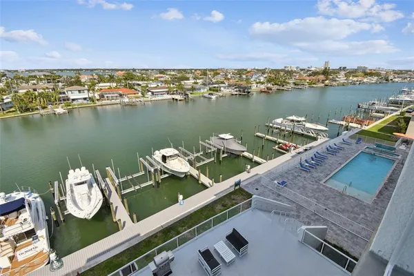 an aerial view of a house with outdoor seating