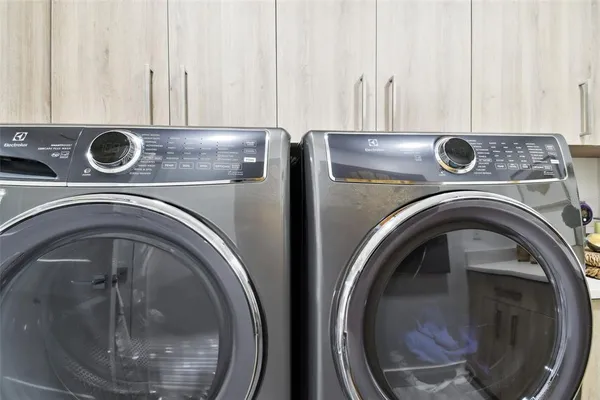 a view of washer and dryer in a utility room