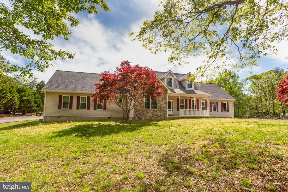 400 Adelina Road Prince Frederick, MD 20678 - Photo 3 of 57 Charming home with vibrant landscaping.