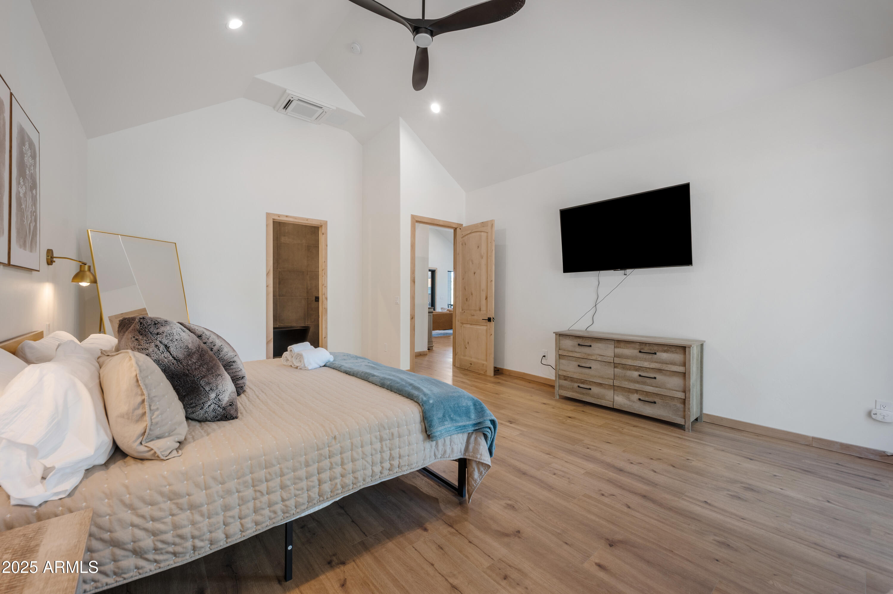 820 West Apache Lane Lakeside, AZ 85929 - Photo 14 of 40 a bedroom with a bed and a flat screen tv