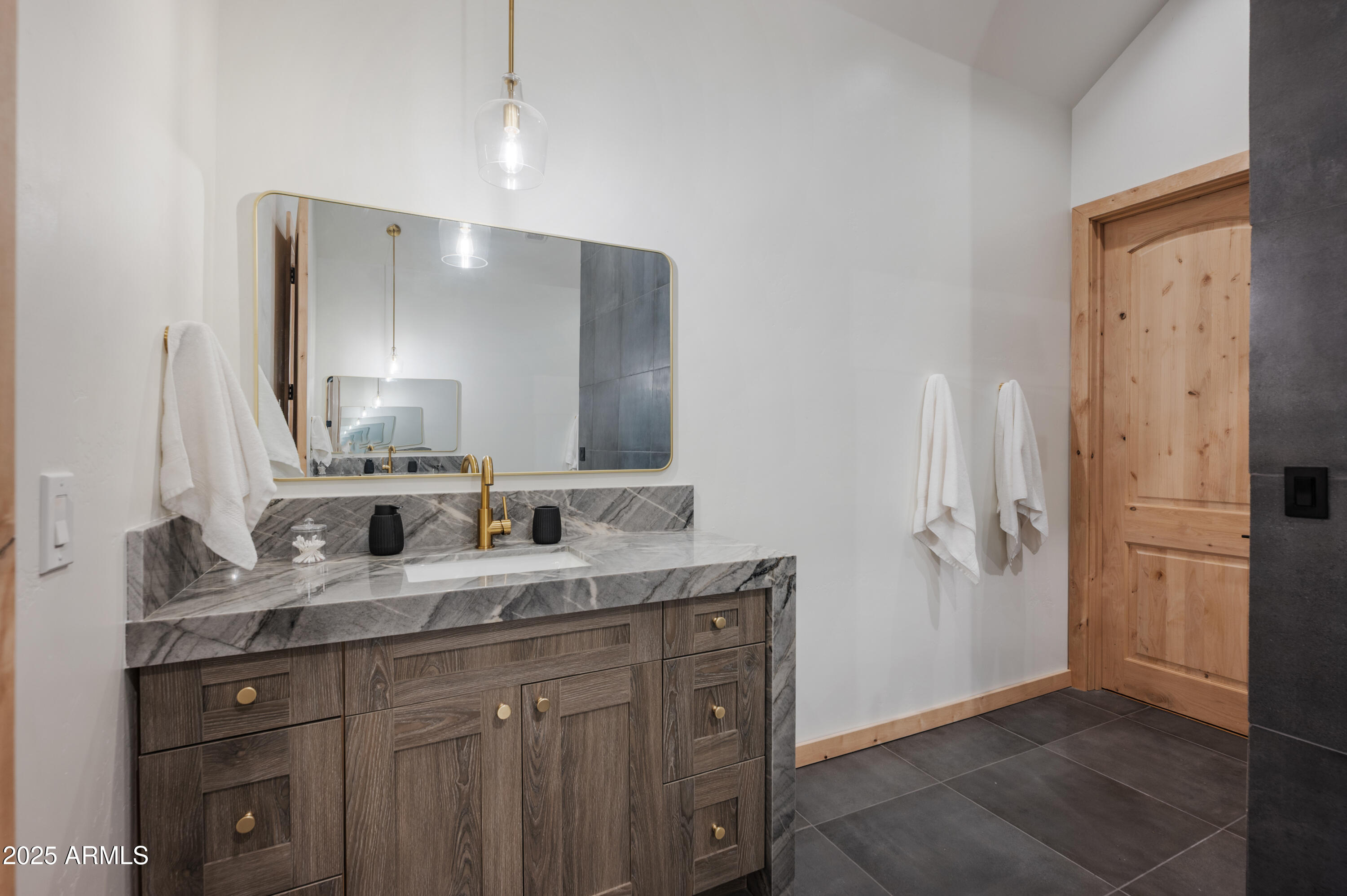 820 West Apache Lane Lakeside, AZ 85929 - Photo 15 of 40 a bathroom with a granite countertop sink and a mirror