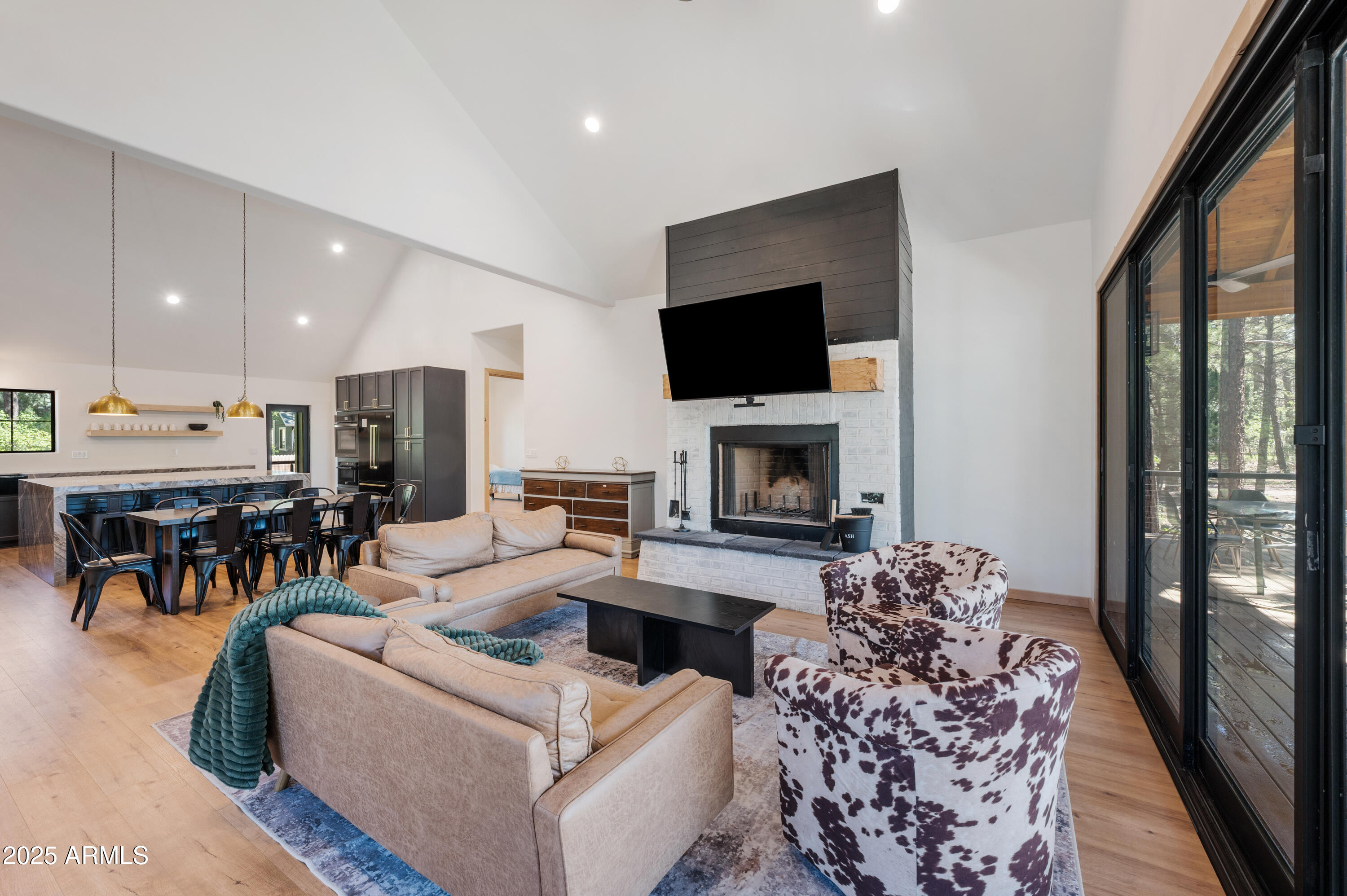 820 West Apache Lane Lakeside, AZ 85929 - Photo 21 of 40 a living room with furniture a flat screen tv and a fireplace