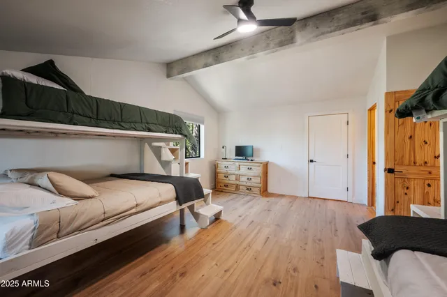 a bedroom with bed and window