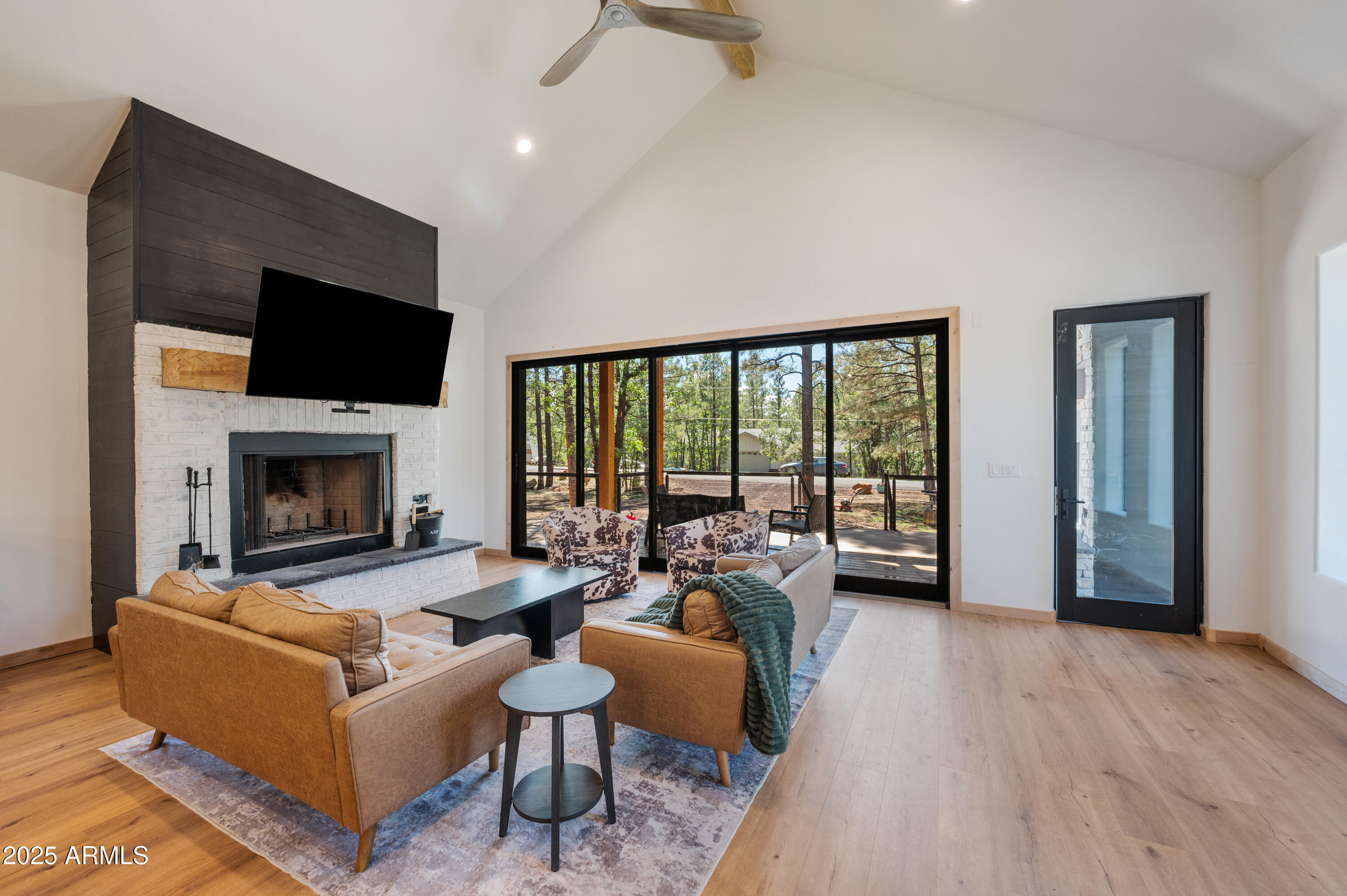 820 West Apache Lane Lakeside, AZ 85929 - Photo 5 of 40 a living room with furniture fireplace and a flat screen tv