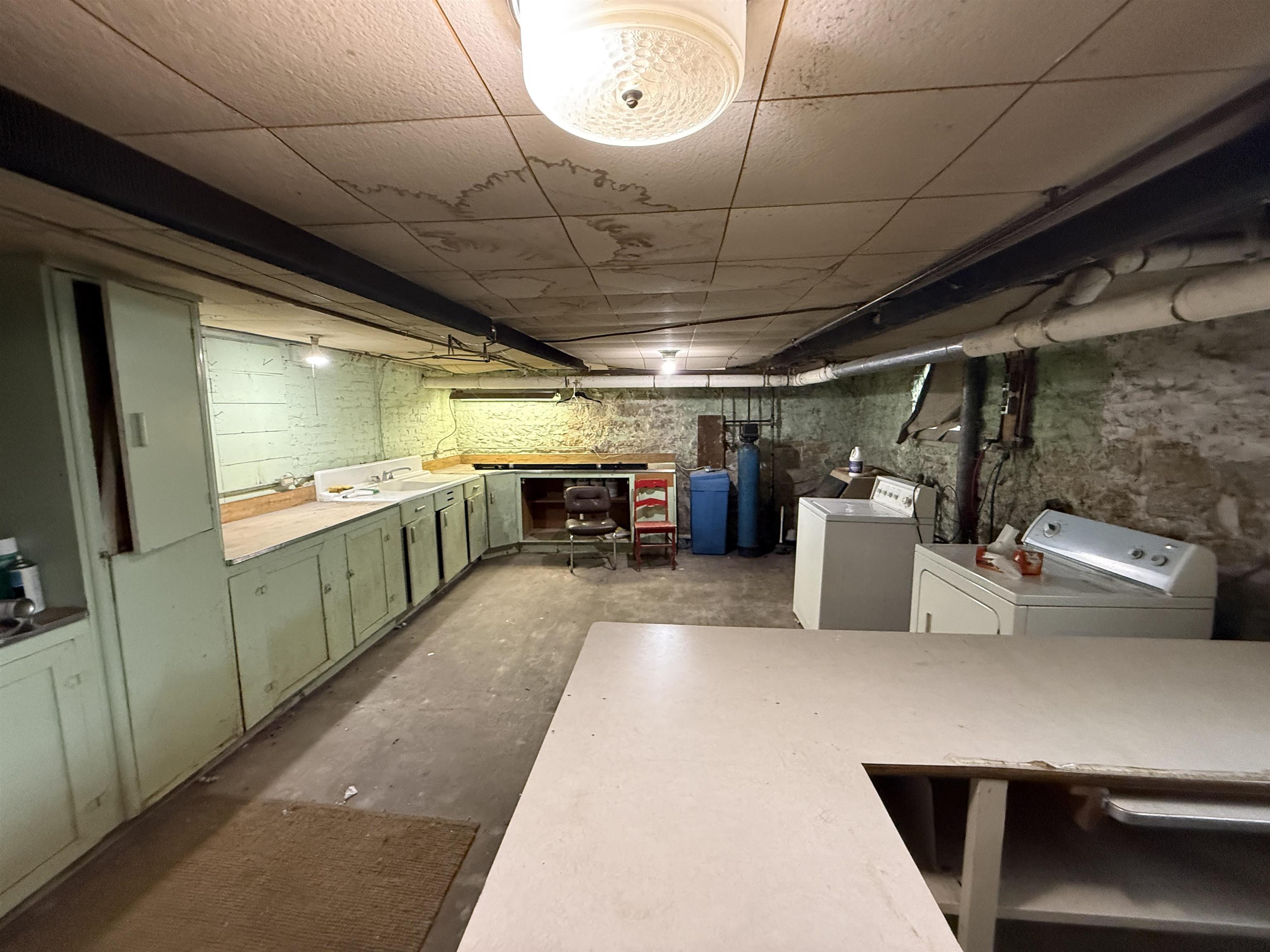 323 South Main Street Stockton, IL 61085 - Photo 25 of 32 a kitchen with a refrigerator and a counter