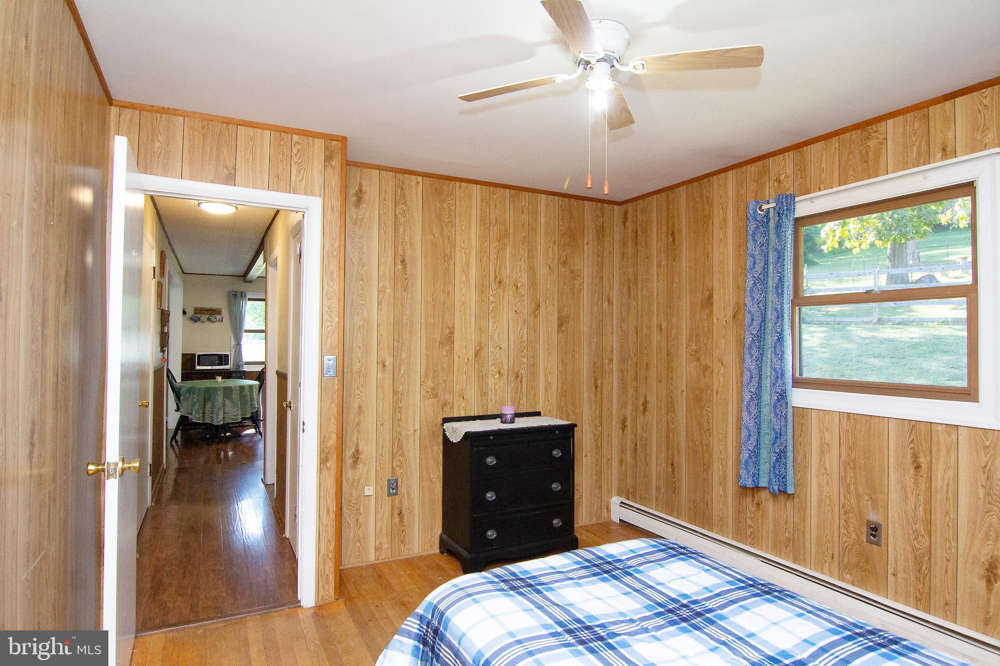 3548 Lineboro Road Manchester, MD 21102 - Photo 16 of 43 a bedroom with a bed and a window