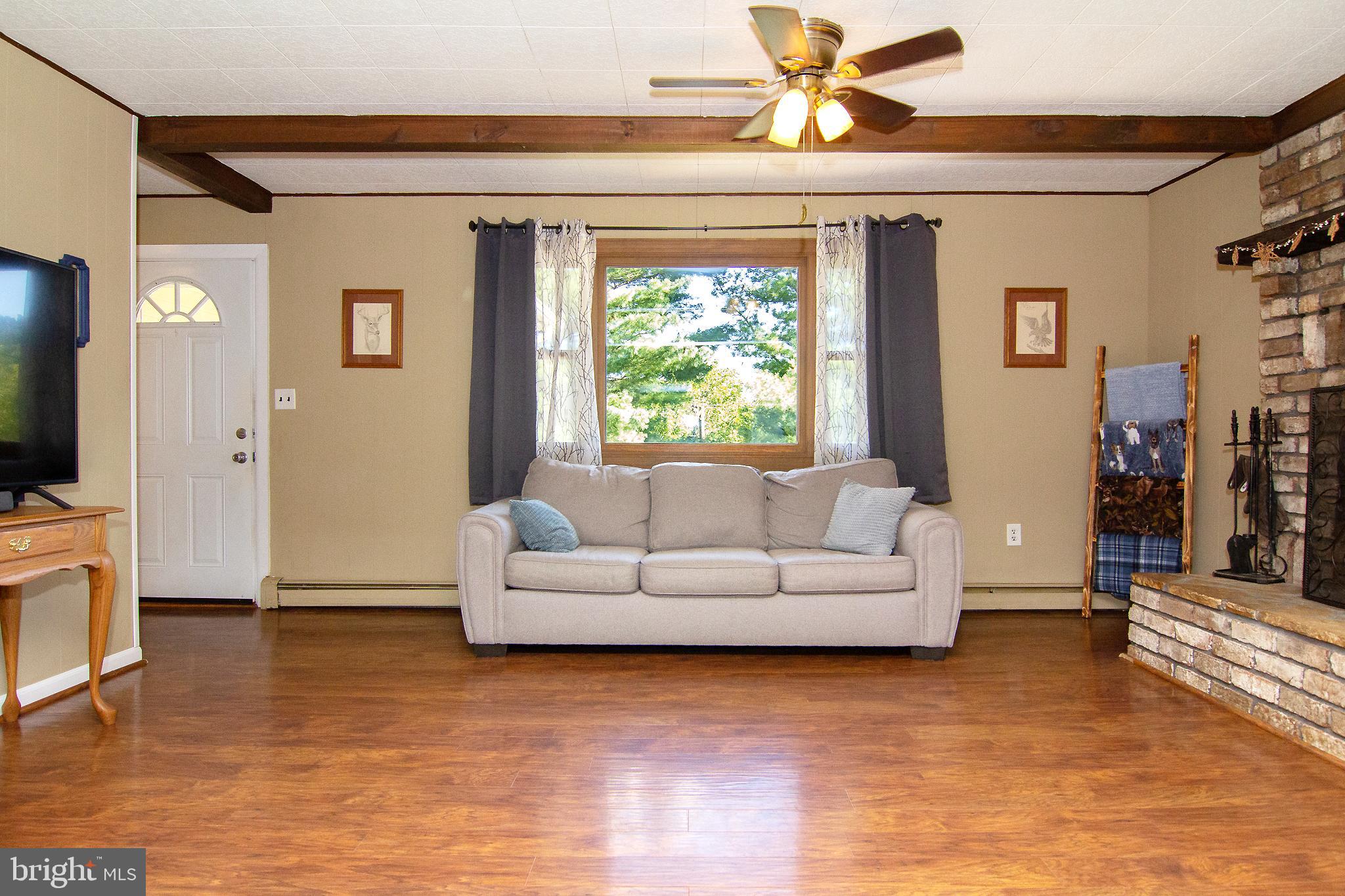 3548 Lineboro Road Manchester, MD 21102 - Photo 3 of 43 a living room with furniture and a flat screen tv
