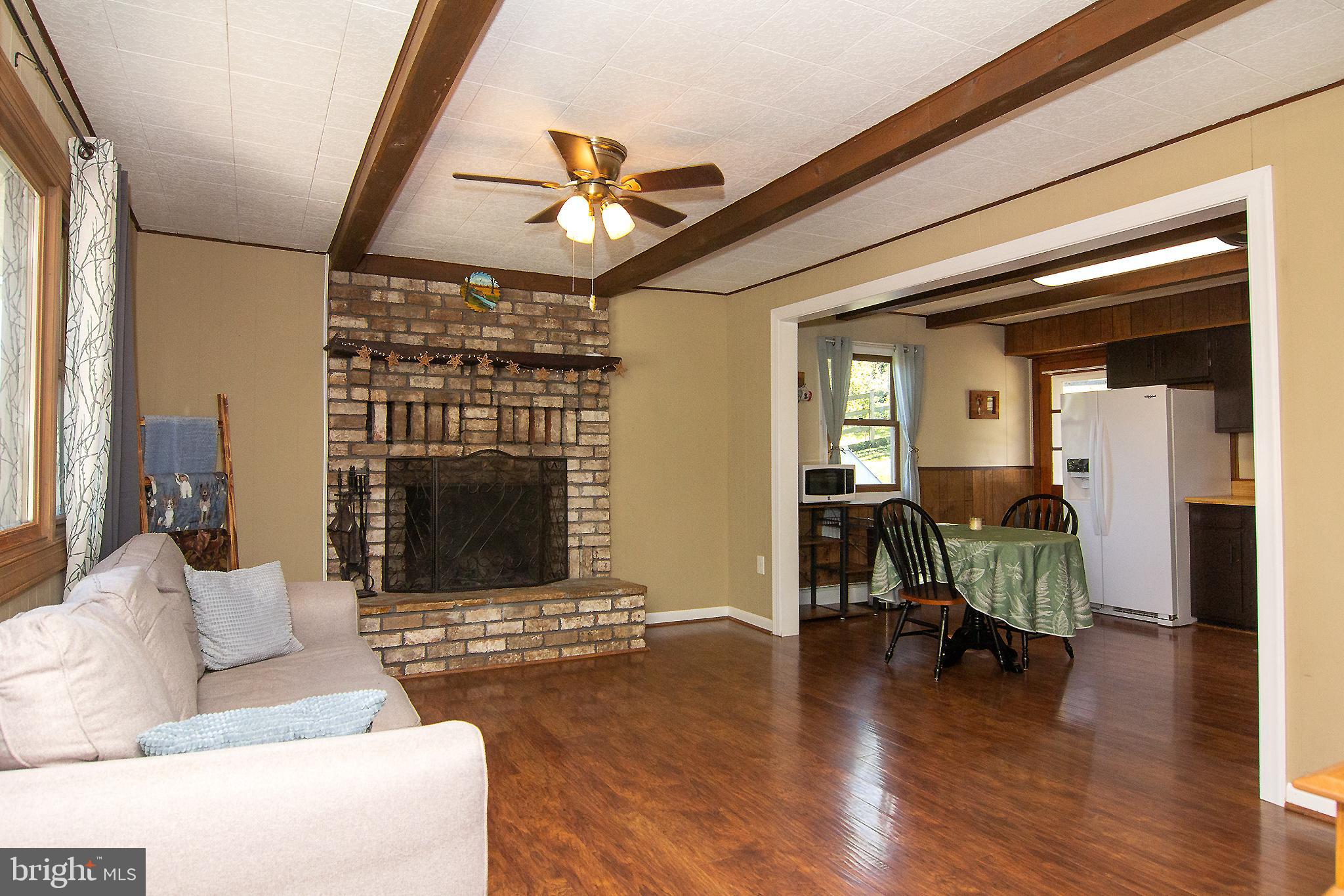 3548 Lineboro Road Manchester, MD 21102 - Photo 4 of 43 a living room with furniture and a fireplace