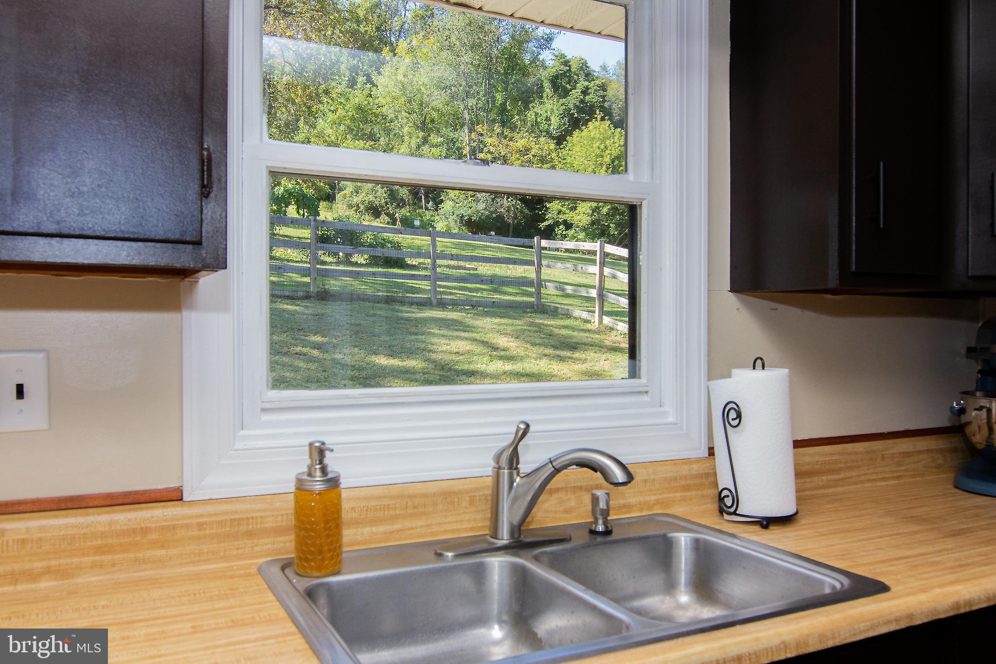3548 Lineboro Road Manchester, MD 21102 - Photo 8 of 43 a kitchen with a sink a counter space and a window