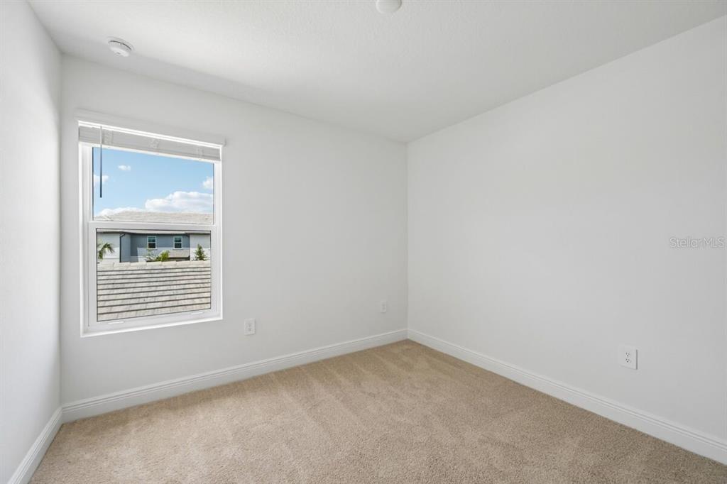 17712 Broadleaf Loop Venice, FL 34293 - Photo 10 of 23 an empty room with a window