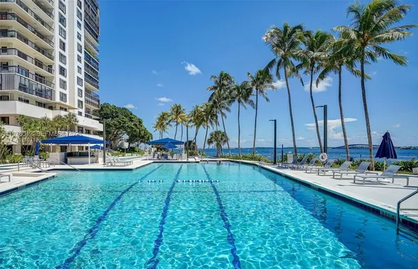 a view of a swimming pool with chairs