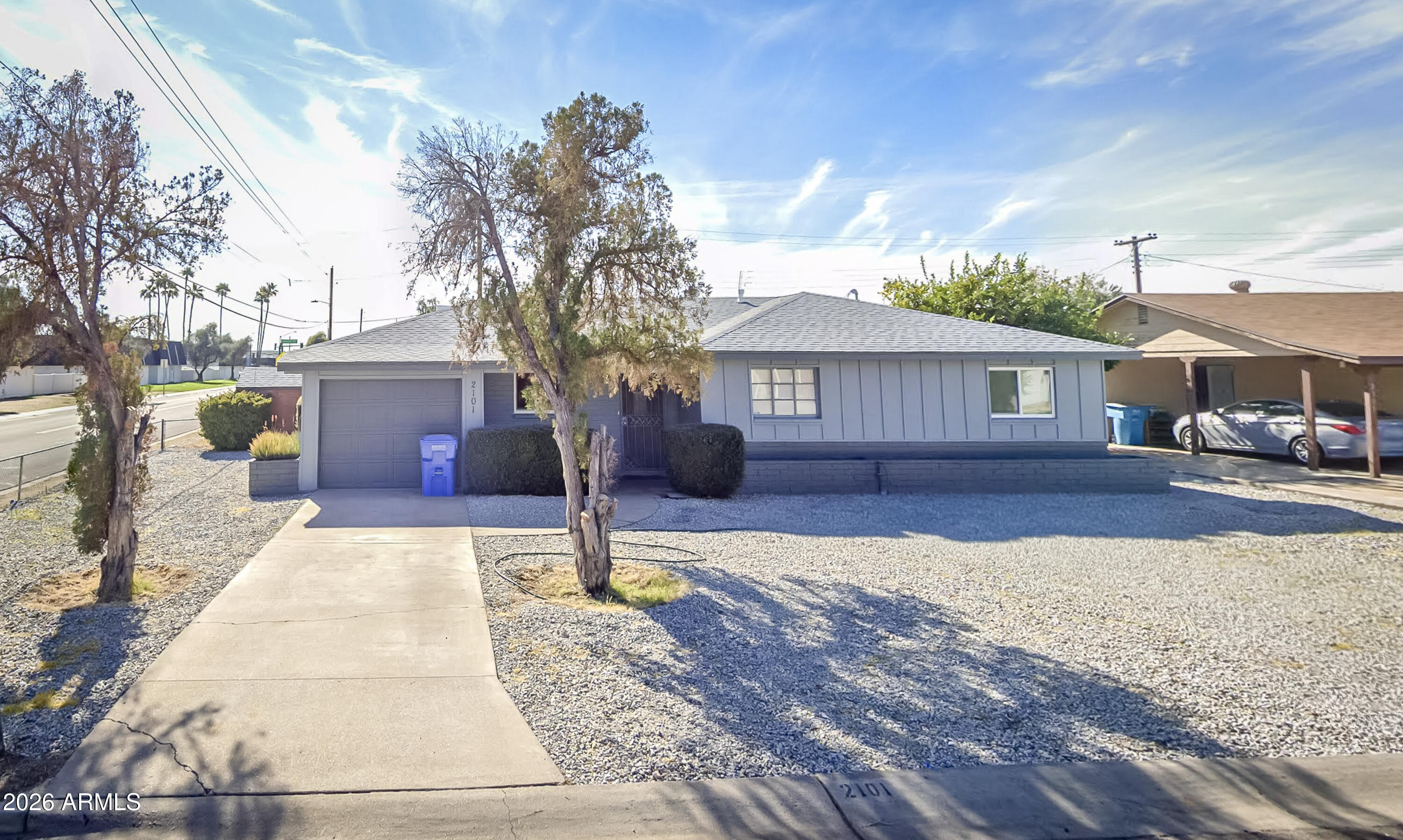 2101 West Glenn Drive Phoenix, AZ 85021 - Photo 1 of 48 a front view of a house with a yard and potted plants