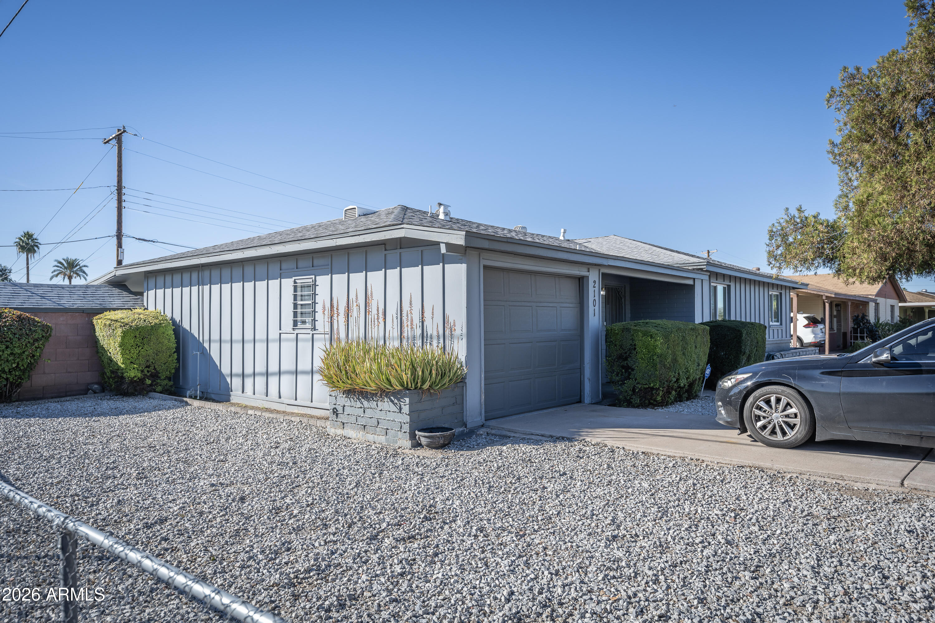 2101 West Glenn Drive Phoenix, AZ 85021 - Photo 12 of 48 a view of a house with backyard and roof