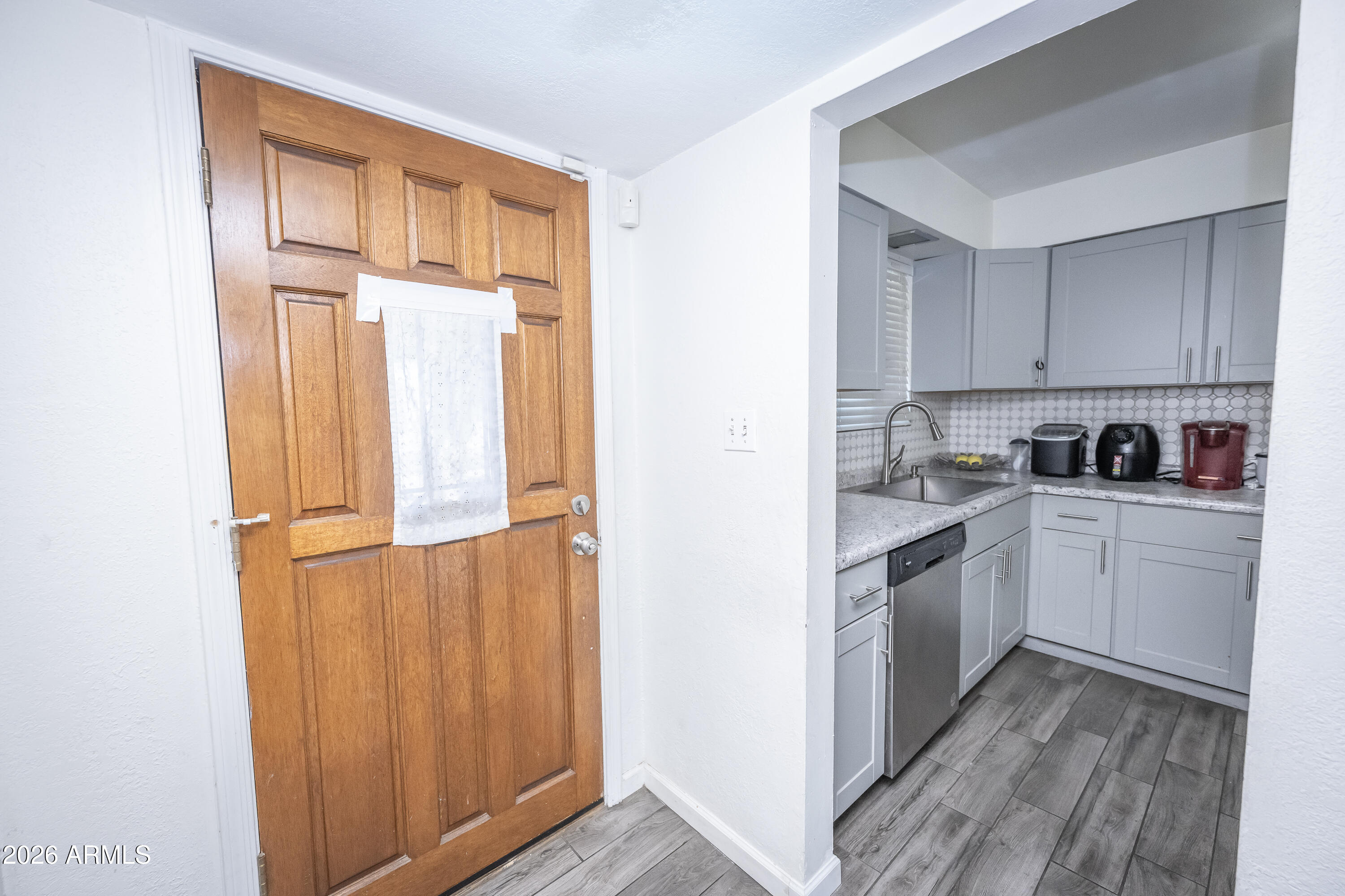 2101 West Glenn Drive Phoenix, AZ 85021 - Photo 14 of 48 a kitchen with granite countertop cabinets stainless steel appliances and sink
