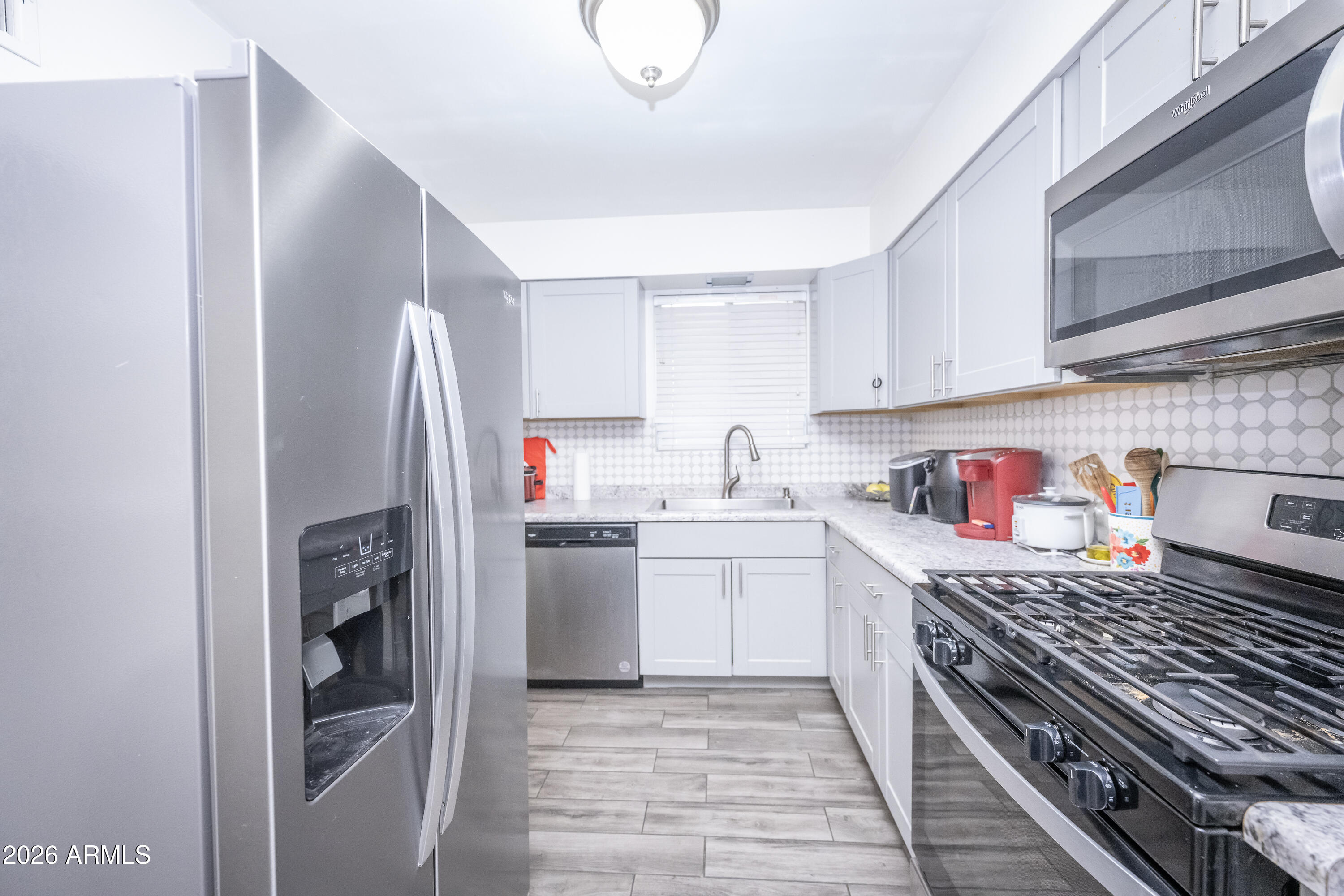 2101 West Glenn Drive Phoenix, AZ 85021 - Photo 19 of 48 a kitchen with a refrigerator and a sink