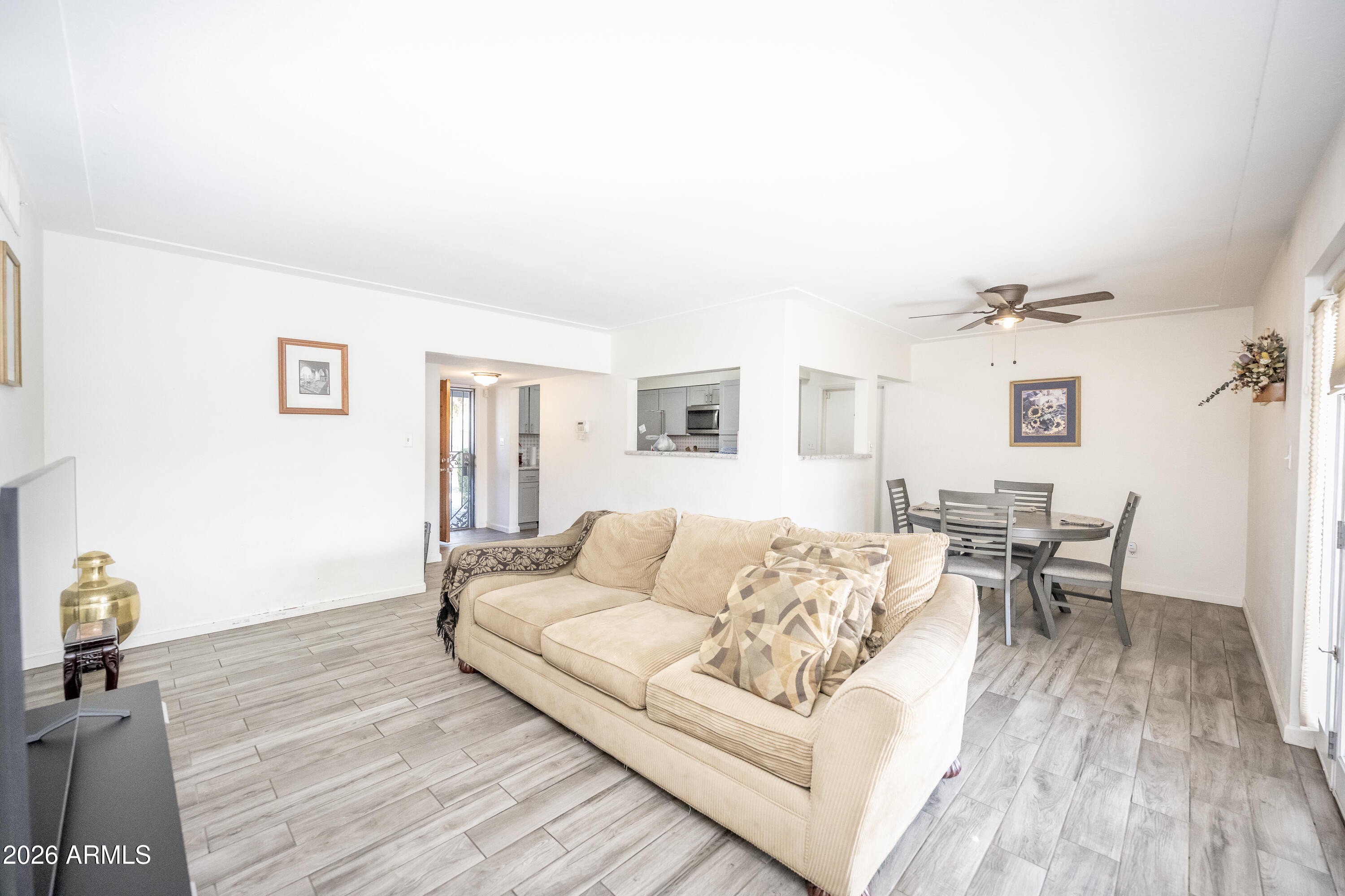 2101 West Glenn Drive Phoenix, AZ 85021 - Photo 27 of 48 a living room with furniture and wooden floor