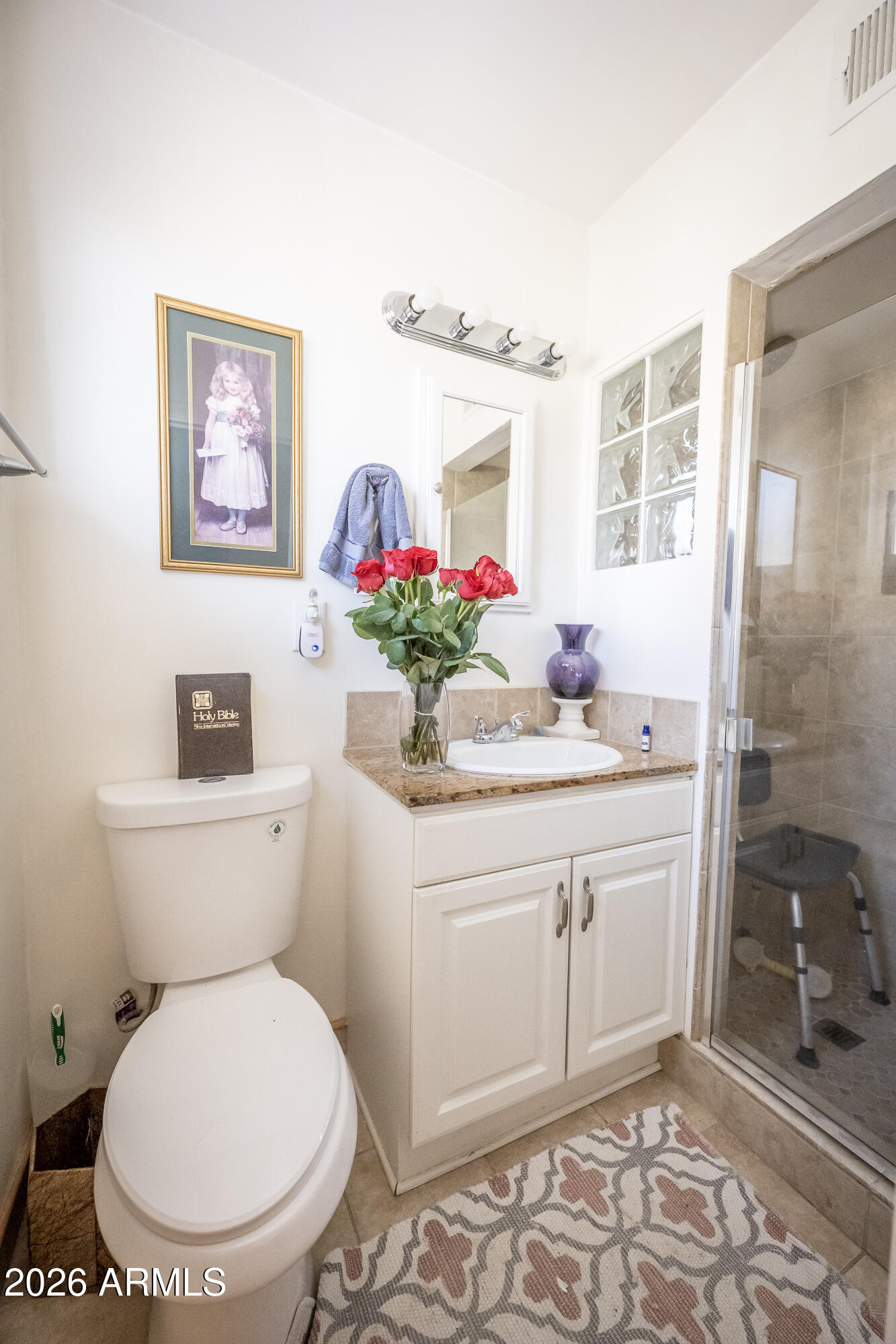 2101 West Glenn Drive Phoenix, AZ 85021 - Photo 42 of 48 a bathroom with a toilet sink vanity granite and mirror