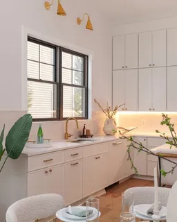 a bathroom with a sink vanity granite toilet and a mirror