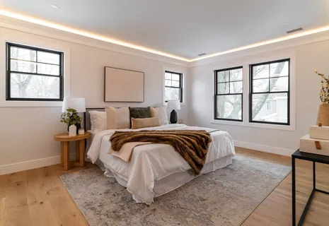 a bedroom with a bed and window