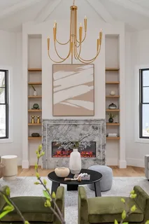 a living room with furniture a fireplace and a window