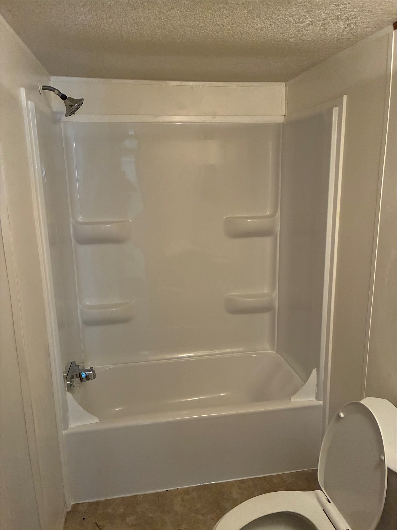 3410 Old Houston Road, Unit B Huntsville, TX 77340 - Photo 7 of 7 a bathroom with a bathtub and a shower