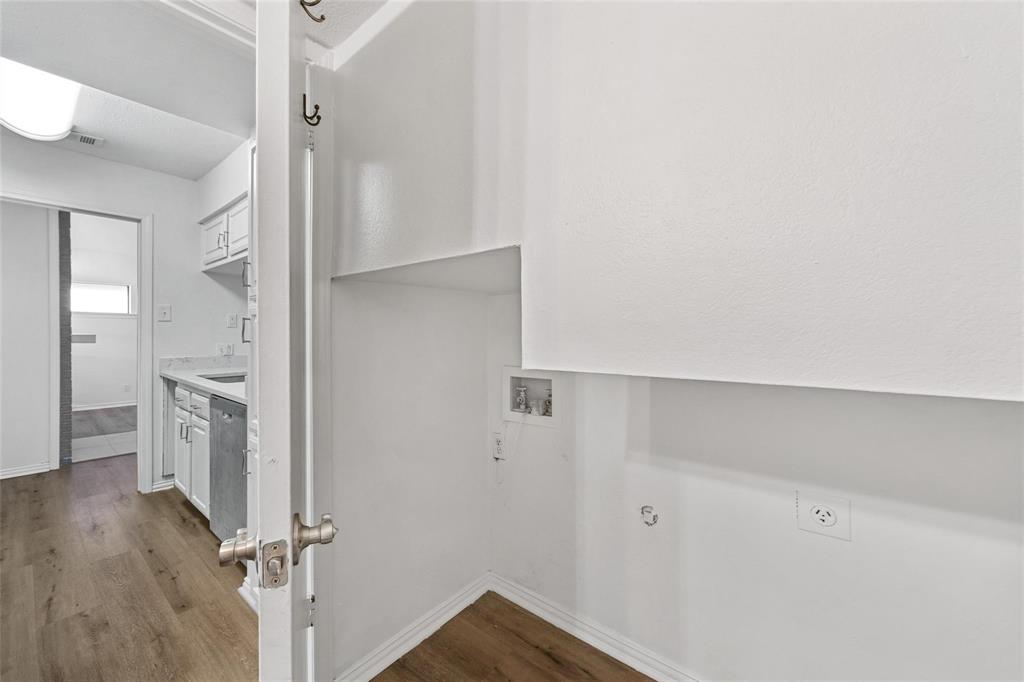18240 Midway Road, Unit 402 Dallas, TX 75287 - Photo 26 of 29 Dedicated laundry area featuring hookups and a wood-finish flooring